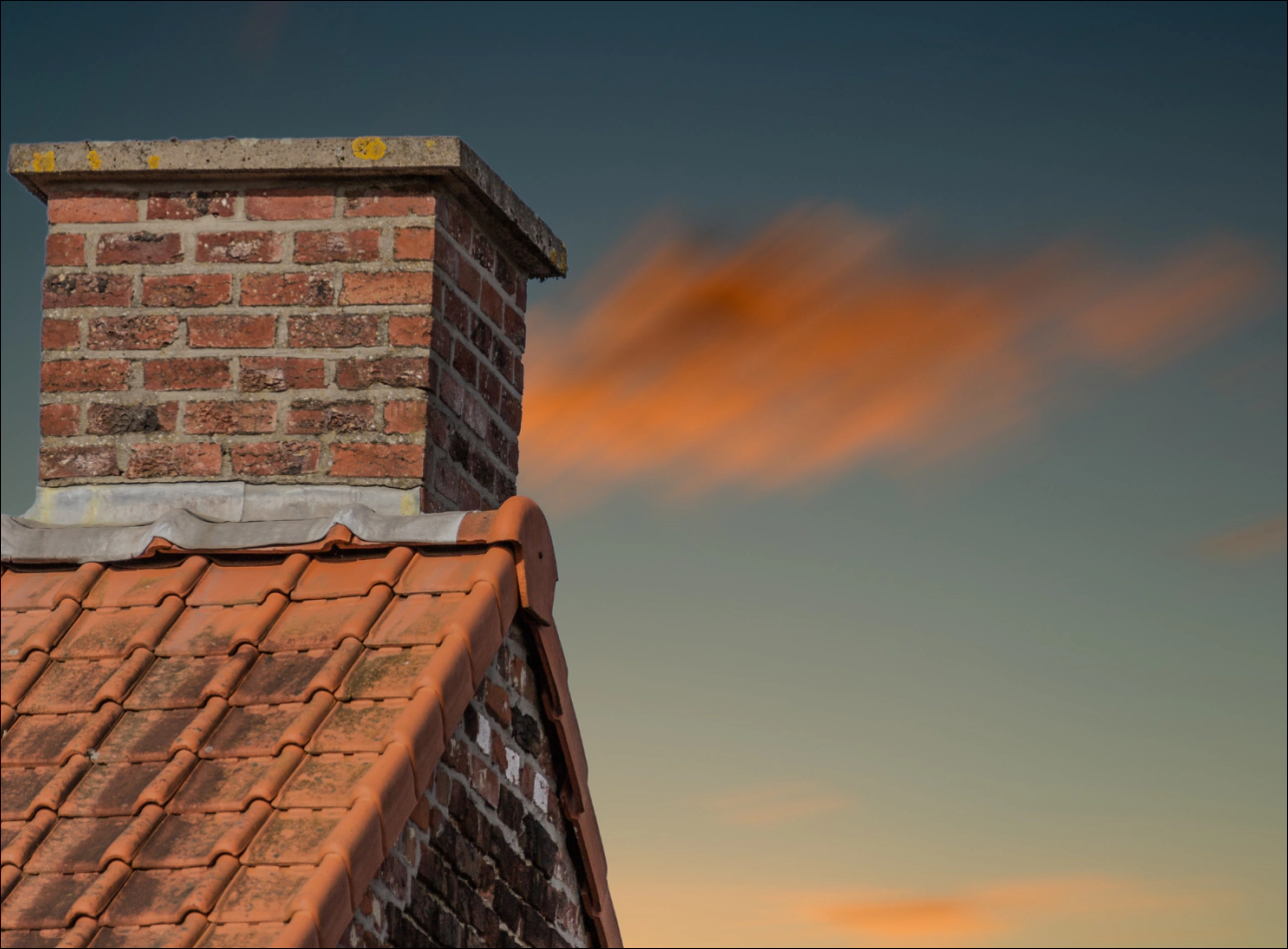 a chimney on a sunset